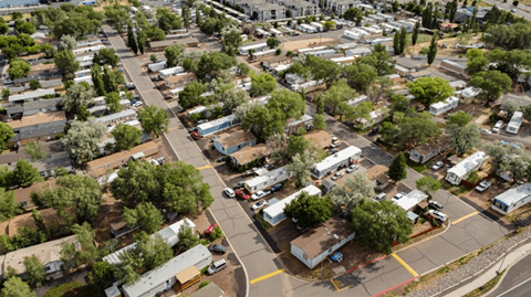 A bird's eye view of a residential area with houses and trees.